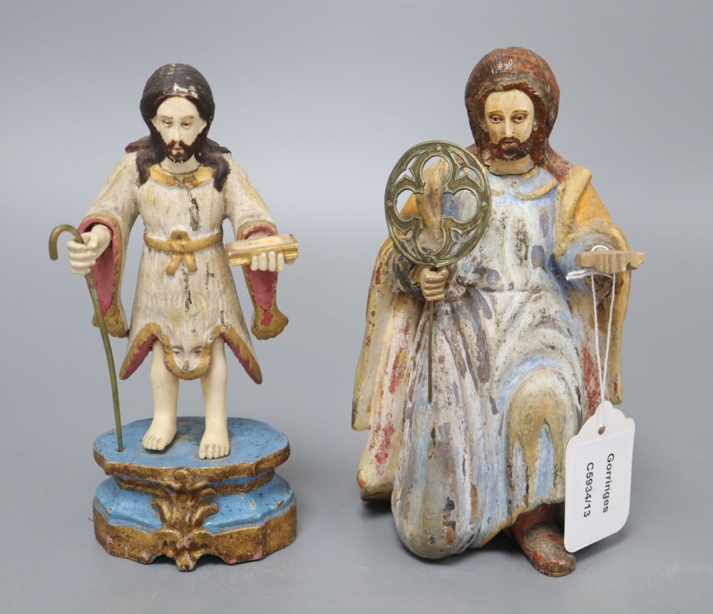 A painted carved wood religious figure of a kneeling saint and a similar painted carved wood and ivory figure, tallest 19cm